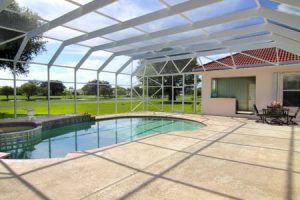 Screen enclosure over a pool